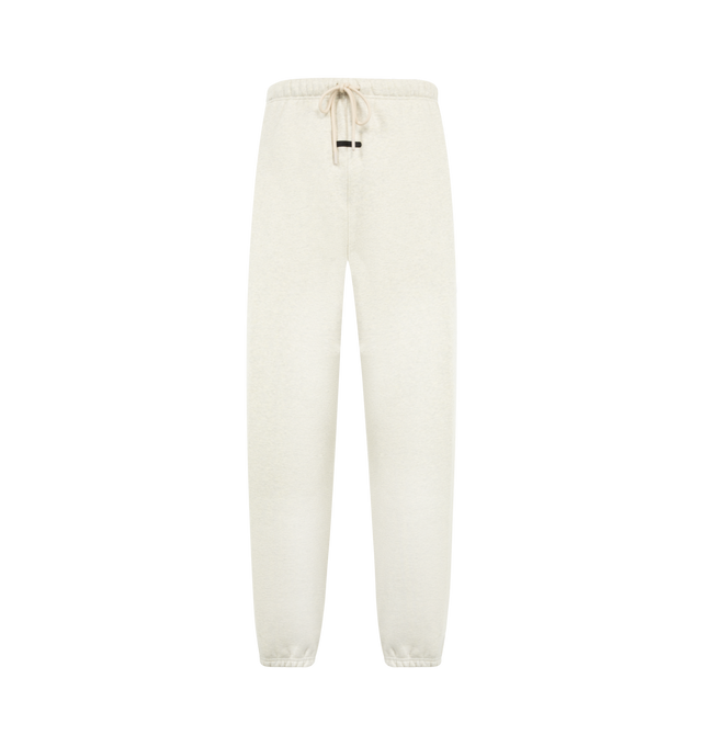 Image 1 of 3 - NEUTRAL - Fear of God Essentials Mens Classic Sweatpants are crafted from heavyweight 380 GSM cotton-blend core fleece. Feature a classic relaxed fit with tapered legs, elasticized waistband with bungee drawcord, side-seam pockets, elastic ankle cuffs, puff-printed Fear of God and Essentials branding, and an Essentials logo label. Main Material: 80% Cotton, 20% Polyester.  