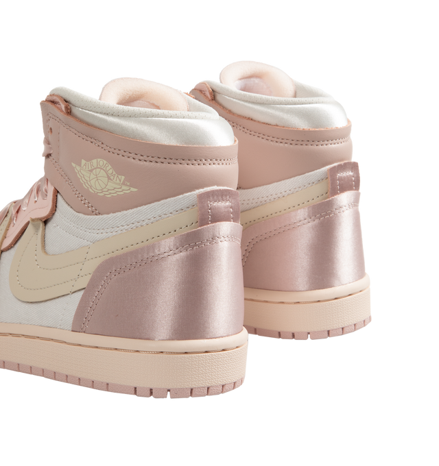 Image 3 of 5 - PINK - Women's Air Jordan 1 Method Of Make high top sneakers in Pink Oxford, Legend Light Brown, Atmosphere colorway inspired by pointe shoes playing with textures and proportions with satin details and exaggerated proportions including a larger Swoosh for a distinctive look. 