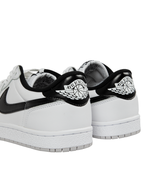 Image 3 of 5 - WHITE - Nike Dunk Low Sneakers with White and grey upper, black swoosh, padded, low-cut collar, leather upper, foam midsole offering lightweight, responsive cushioning. Perforations on the toe add breathability. Rubber sole with classic hoops pivot circle provides durability and traction. 