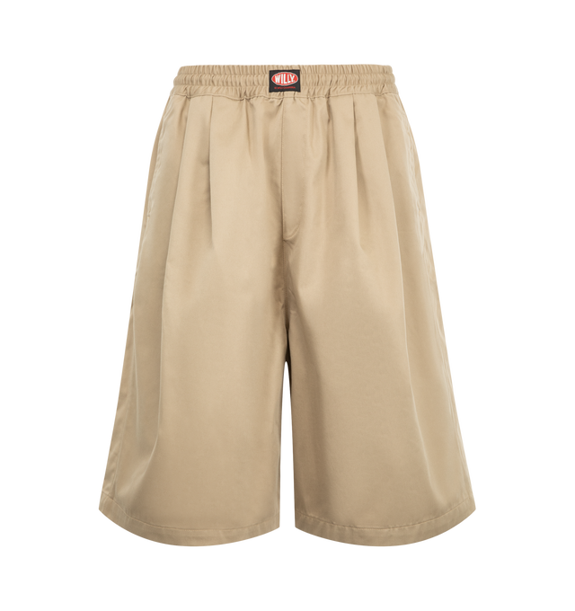 Image 1 of 3 - NEUTRAL - Willy Chavarria Orale Elasticated Short is crafted from a polyester-cotton blend and features a relaxed, voluminous silhouette with an elasticated waistband for everyday comfort. Designed with the brand's signature oversized proportions and clean utility-inspired styling. Main Material: 65% Polyester, 35% Cotton. Lining: 100% Cotton. Made in USA. 