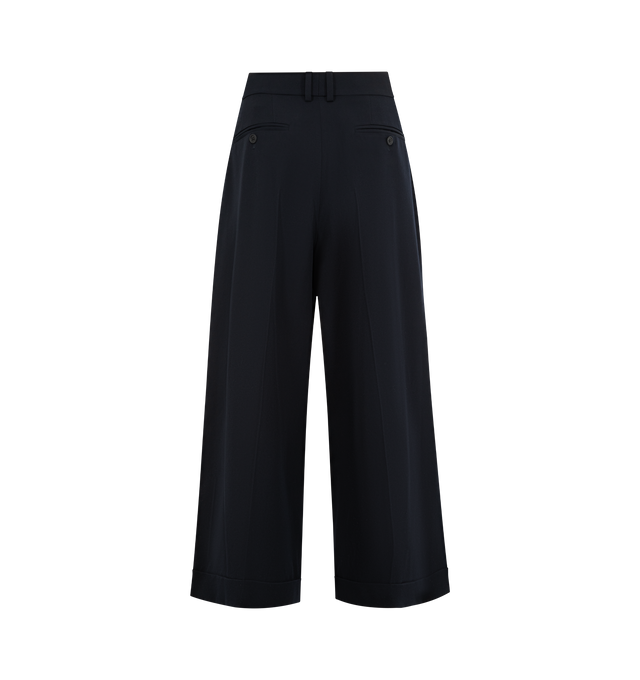 Image 4 of 5 - NAVY - THE ROW Lior Pant featuring tailored low-rise trouser in fluid Japanese wool gabardine with wide cuffed leg, front double pleats, and side slash pockets. 100% wool. Made in Italy. 