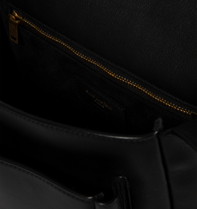 Image 3 of 3 - BLACK - Saint Laurent Niki satchel crafted from finely grained leather, fully lined in tonal leather. Featuring two compartments, an adjustable strap for bespoke carry options., bronze-toned hardware, magnetic closure, and one zip pocket. Measures 8.5 x 6.5 x 3.1 inches with 18.5 inch strap drop. Made in Italy. 