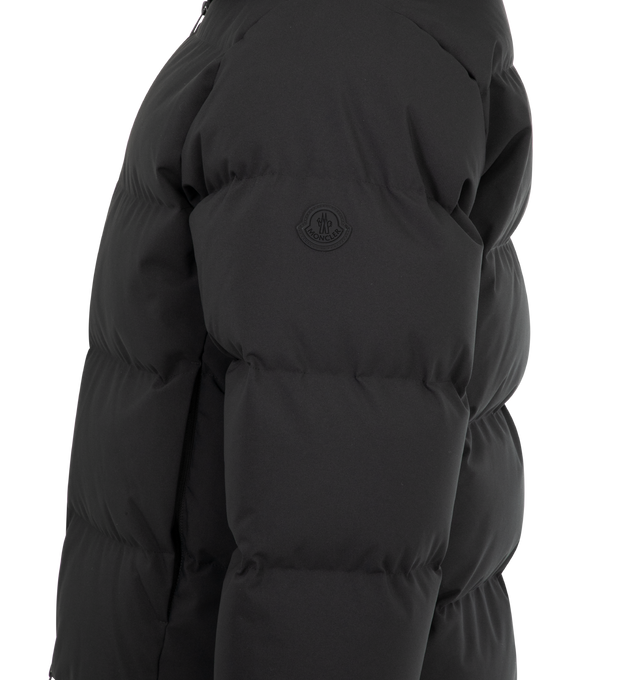 Image 3 of 3 - BLACK - MONCLER Languedoc Hooded Short Down Jacket featuring 2L technical nylon, nylon lining, down-filled, adjustable hood with embossed logo, zipper closure, zipped pockets, adjustable hem and silicone logo patch. 100% polyester. Padding: 90% down, 10% feather. Made in Romania. 