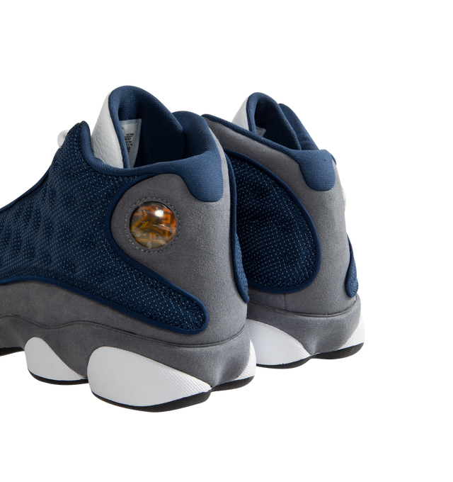 Image 3 of 5 - BLUE - Men's Jordan 13 "Flint 2020" Sneakers feature a premium leather upper with Flint Grey nubuck overlays, French Blue reflective ballistic mesh panels, and the signature holographic emblem for an iconic heritage design. These lifestyle sneakers combine responsive cushioning, a supportive midsole, and a durable rubber outsole for lasting comfort, stability, and everyday traction. Main Material: Leather, Nubuck, and Textile. Midsole: Cushioned Foam. Sole: Rubber.  