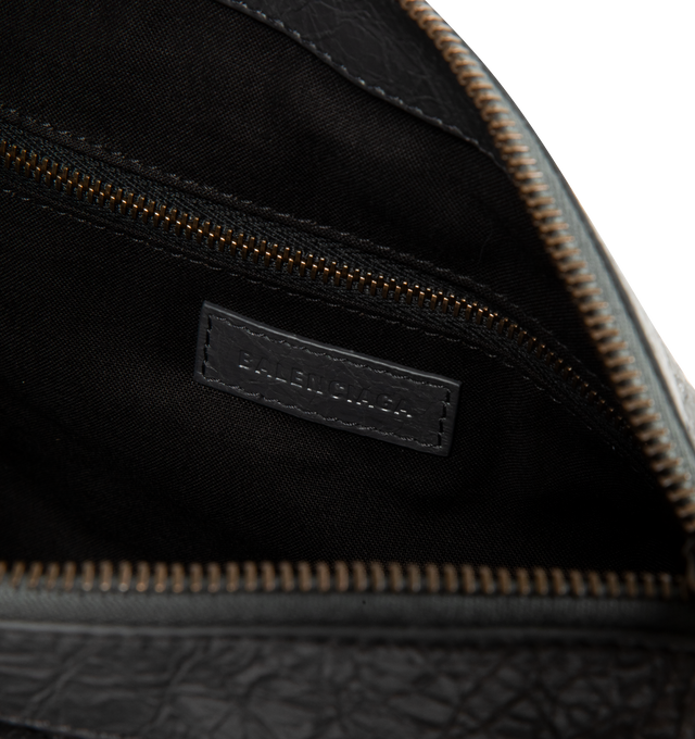 Image 4 of 4 - BLACK - BALENCIAGA Le City Moto Small BAG in volcanic rock Arena Storico lambskin featuring bottle caps charms, one removable shoulder strap, crossbody and shoulder carry, brass hardware, zipped closure with knotted leather puller, front zipped pocket with knotted leather puller, 1 main compartment, 1 inner zipped pocket and cotton canvas lining. L11 x H7.5 x W5.5 inch. Lambskin, brass, zamak. Made in Italy. 