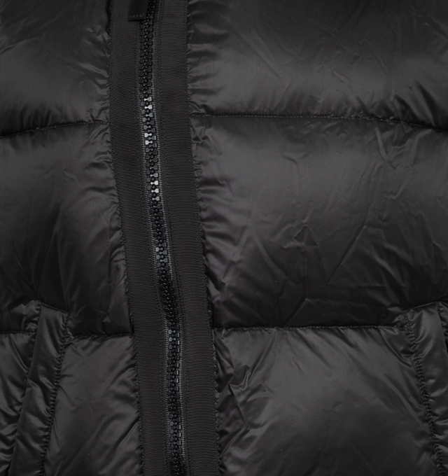 Image 3 of 3 - BLACK - SACAI Asymmetric Zipper Puffer Vest featuring high neckline, asymmetric two-way zip front, sleeveless, side pockets, relaxed fit and drawcord hem. Nylon/polyester. Polyester/down/feather fill. 