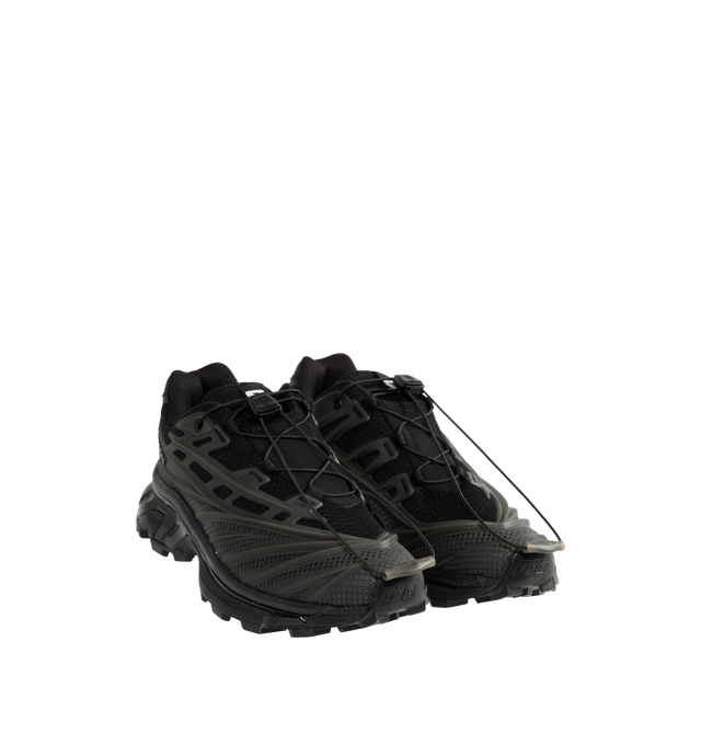 Image 2 of 5 - BLACK - Salomon Unisex XT-EVO Sneakers are built with a synthetic and textile upper and are made to be a performance-driven combining stability and cushioning for lasting comfort. Additional details include Quicklace one-pull lacing, endoFit internal sleeve construction, sensiFIT support, seamless construction, and a lace pocket for streamlined wear. A molded OrthoLite sockliner and Mud ContaGRIP rubber outsole enhance cushioning, durability, and traction across varied terrain. Upper: Synthet 