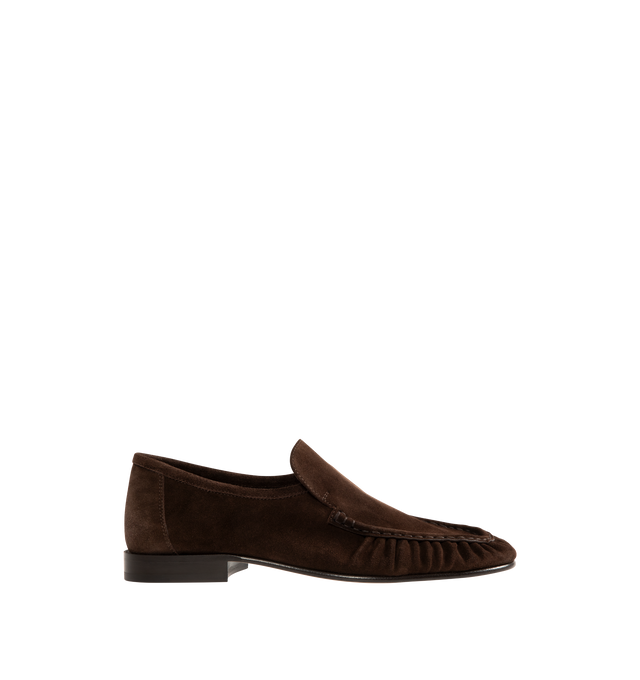 Image 1 of 4 - BROWN - THE ROW Soft Moccasin Two featuring moccasin loafer in soft calfskin suede with oval toe, topstitched front detailing with natural pleating effect and stacked leather heel. 100% calfskin suede. Lined in 100% goatskin leather. Calfskin leather sole. Made in Italy. 