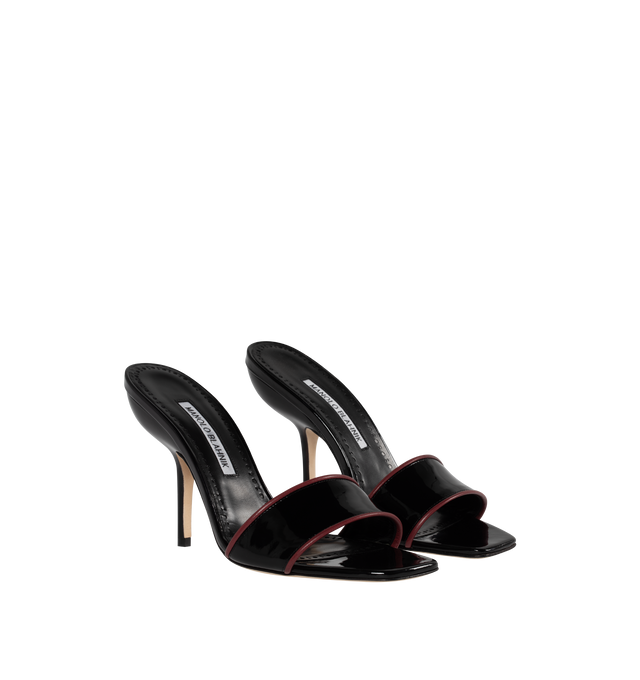Image 2 of 4 - BLACK - MANOLO BLAHNIK Helamu Mules featuring patent leather, open toe, toe strap with red lamb nappa edging and angular stiletto high heel. 95% calf patent, 5% lamb nappa. Sole: 100% calf leather. Lining: 100% kid leather. 105MM. Made in Italy. 