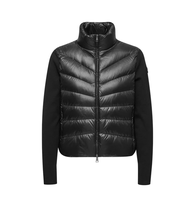 Image 1 of 1 - BLACK - Moncler Womens Wool Down Padded Cardigan is crafted from virgin wool and features a gauge 14 knit, down-filled Longue Saison front and back panels, a turtleneck, zipped pockets, and lightweight insulation. This designer padded cardigan combines premium wool knitwear with signature quilted detailing for versatile everyday layering. Main Material: Sleeves: 100% Virgin Wool; Front & Back: 100% Polyamide; Front Lining: 100% Polyamide; Back Lining: 100% Polyamide; Padding: 90% Down, 10% Fe 