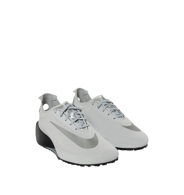 Image 2 of 5 - SILVER - Nike First Sight Noir Sneakers feature smooth textile uppers with tonal rubber overlays and a sculpted wedge sole for a futuristic take on retro running style. These lifestyle sneakers combine lightweight comfort with modern design, finished with chrome-effect detailing at the heel for a bold statement. Main Material: Textile and Synthetic. Sole: Rubber. 