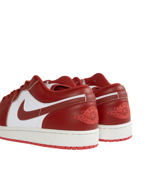 Image 3 of 5 - RED - AIR JORDAN 1 low-top lace-up sneakers crafted from leather and textiles in the upper for durability and structure and Nike Air-Sole unit for lightweight cushioning.Rubber in the outsole gives you traction on a variety of surfaces. Features stitched-down Swoosh logo and Jumpman Air design on tongue. 