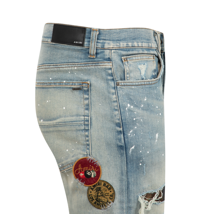 Image 3 of 3 - BLUE - Amiri Vintage Patch Slim Jeans are a 5-pocket style with overall distressing, patch appliques, and a leather logo label at the back. 92% cotton, 6% elastomultiester  