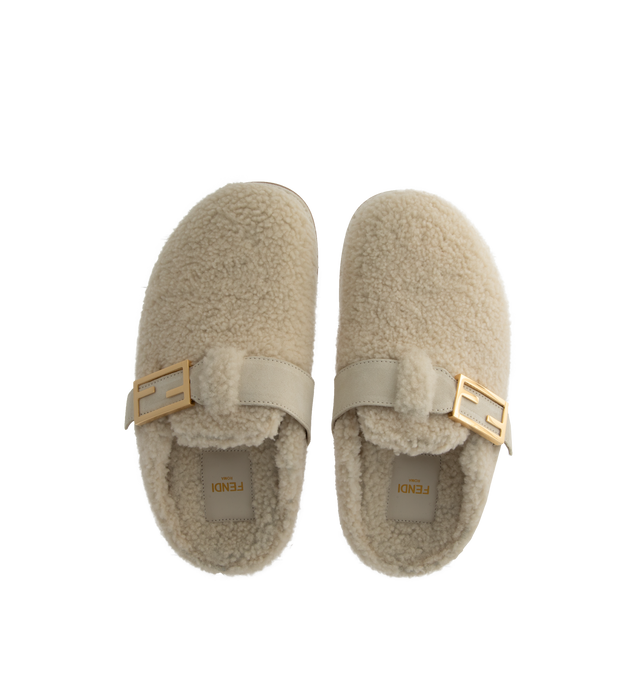 Image 4 of 4 - WHITE - Fendi Women's Feel Sheepskin round-toed sabots with FF strap. Made of white sheepskin. White split leather details. Gold-finish metalware. Made in Italy.  Composition: 100% sheep fur, 100% calf leather, inside: 100% calf leather, 100% sheep fur. 