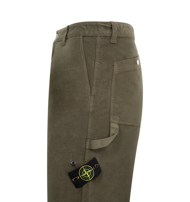 Image 3 of 3 - GREEN - STONE ISLAND Loose Fit Trousers featuring slanted hand pockets, small pocket on right side under waistband with snap, back patch pockets with slanted entrance and snap, tape loop under left pocket, small vertical pocket with snap on back of right leg, Stone Island badge on left leg, zip and button fly and loose fit. 100% cotton. 