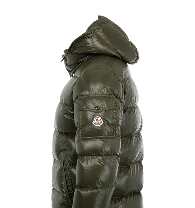 GREEN - MONCLER Maya Jacket featuring nylon laqu lining, down-filled with boudin quilting, detachable hood with snap buttons, adjustable with drawstring fastening, two-way zipper closure, zipped pockets, adjustable, elasticized cuffs with snap buttons, hem with drawstring fastening, flap patch pocket on sleeve and felt Moncler logo on sleeve. 100% polyamide/nylon. Padding: 90% down, 10% feather. 