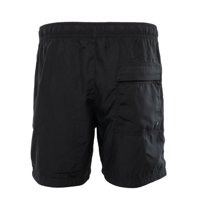 Image 2 of 4 - BLACK - STONE ISLAND Swim Trunks featuring regular fit, patch hand pockets with slanting opening edged with inner tape, back patch pocket with fixed flap and hidden zipper closure with nylon trim, Stone Island Compass patch logo on the left leg, inner mesh lining and elasticized waistband with outer drawstring set on tap tab. 100% polyester. Lining: 100% polyamide/nylon. 