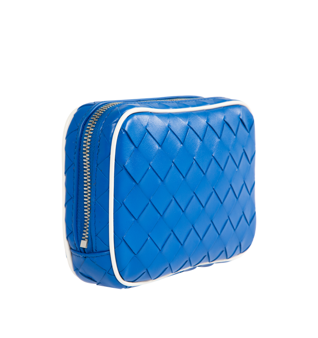 Image 3 of 4 - BLUE - Bottega Veneta small pouch in Intrecciato calf leather with contrasted piping, interior leather tag with embossed logo and zipper closure. Calfskin with canvas lining and silver finish hardware. Measures 5.1" high x 8.7" wide x 1.6" deep. Made in Italy. 