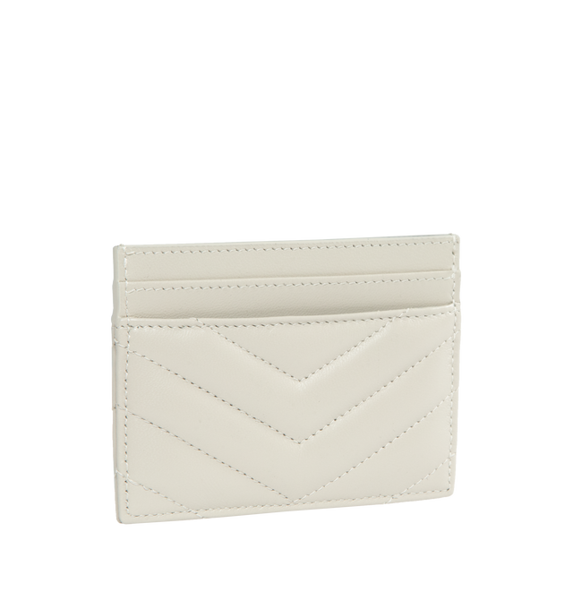 WHITE - SAINT LAURENT Monogram Card Case featuring five card slots, gold tone hardware,the cassandre and chevron-quilted overstitching. 4 X 2.8 X 0.1 inches. 100% lambskin. Made in Italy. 