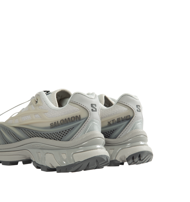 Image 3 of 5 - GREY - Salomon Unisex XT-EVO Sneakers are built with a synthetic and textile upper and are made to be a performance-driven combining stability and cushioning for lasting comfort. Additional details include Quicklace one-pull lacing, endoFit internal sleeve construction, sensiFIT support, seamless construction, and a lace pocket for streamlined wear. A molded OrthoLite sockliner and Mud ContaGRIP rubber outsole enhance cushioning, durability, and traction across varied terrain. Upper: Syntheti 