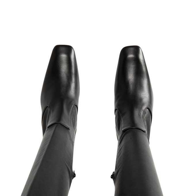 Image 4 of 4 - BLACK - Toteme Women's Nappa Over-the-Knee Boots are crafted from soft stretch Nappa leather and feature a contoured, second-skin silhouette that extends above the knee. Designed with a short side zipper and stretch neoprene lining for a close fit, these designer boots are set on a sculptural bar-shaped, set-back heel and finished with a leather insole and sole. Main Material: 100% Lamb Leather. Lining: 100% Sheep Leather. Sole: 100% Cow Leather. Heel Height: 85 mm / 3.3 in. Closure: Side Zip 