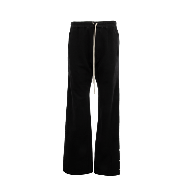 Image 1 of 4 - BLACK - DRKSHDW Pusher Pants featuring drawstring waist, side pockets, snap button and cargo pockets. 100% cotton. 