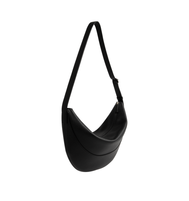 Image 2 of 3 - BLACK - THE ROW Jouve Bag in Leather featuring cescent-shaped crossbody bag in smooth lightweight nappa leather with zipper closure and adjustable strap with metal buckle. 6.3 x 4 x 5.5 in. 100% calfskin leather. Lined in 100% leather. Made in Italy. 