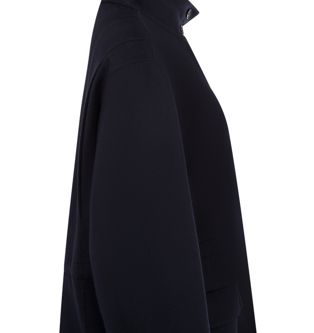 Image 3 of 3 - NAVY - THE ROW Tanera Jacket featuring technical jacket in smooth virgin wool gabardine with concealable hood at collar, adjustable interior drawstring waistband and concealed front placket with zipper and button closures. 100% wool. Lined in 100% silk. Made in Italy. 