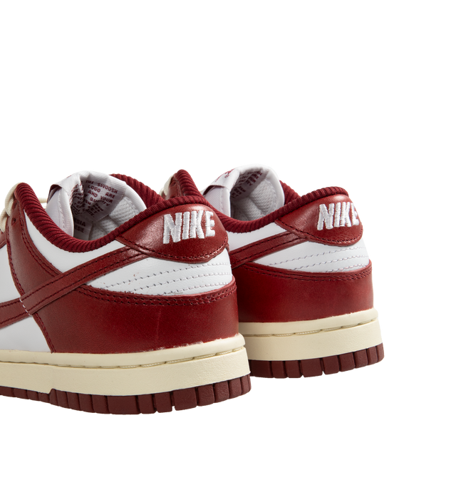 Image 3 of 5 - WHITE - Nike Women's Dunk Low Premium Sneakers have leather uppers, removable insoles, textile linings, and rubber soles.  