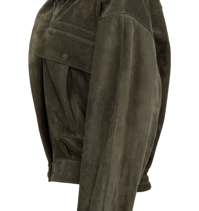 Image 3 of 3 - GREEN - SAINT LAURENT Vintage Split Leather Jacket featuring a stand collar, drop shoulders, shirred back waist, viscose and cotton lining, concealed zip closure with snap-button storm flap, two patch pockets with snap-button flap and two welt pockets at the front, one inner welt pocket, snap-button stand collar, snap-button cuffs and elasticized back hem. 100% calfskin. Made in Italy. This item may be restricted for online purchase to international clients. For assistance purchasing this ite 