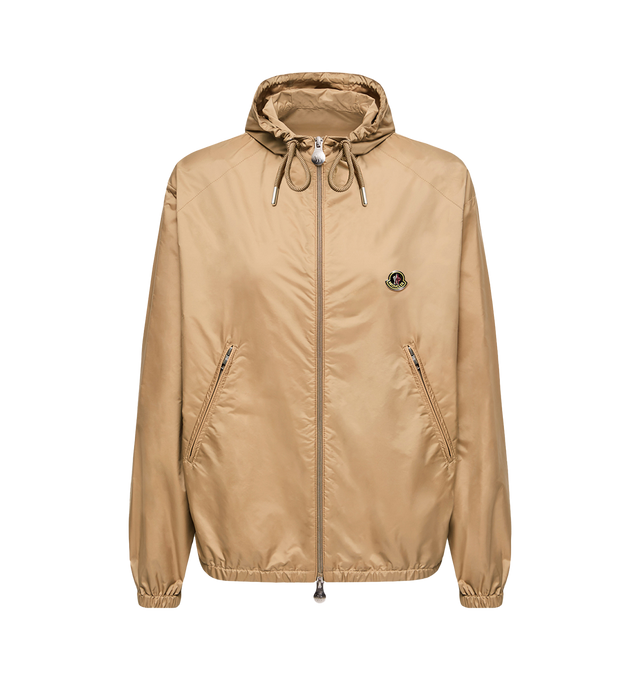 Image 1 of 1 - NEUTRAL - Moncler Women's Hooded Windbreaker is crafted from water-repellent rainwear nylon and features an oversized silhouette, an adjustable hood, and a front zip closure. Inspired by a spirit of exploration, this lightweight outerwear style balances functional protection with a refined contemporary aesthetic. Designed with zipped pockets, elastic cuffs, and an elasticized hem, it is finished with a vintage-inspired metal logo that references Moncler's alpine heritage. Main Material: 100%  