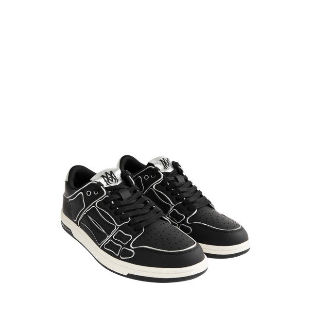 Image 2 of 5 - BLACK - AMIRI Skel Top Low Sneaker featuring round toe, lace-up front, logo patch and contrast trim. 100% Cow Leather. Sole: 100% Rubber. 