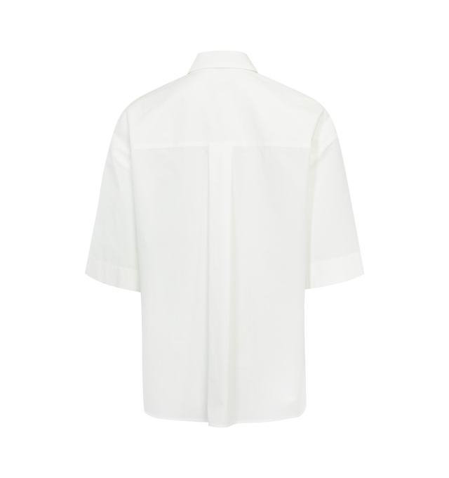 Image 2 of 2 - WHITE - KHAITE Mahsha Shirt featuring spread collar, short sleeves, front patch pockets, high-low hem and classic shirt style. 100% cotton. 