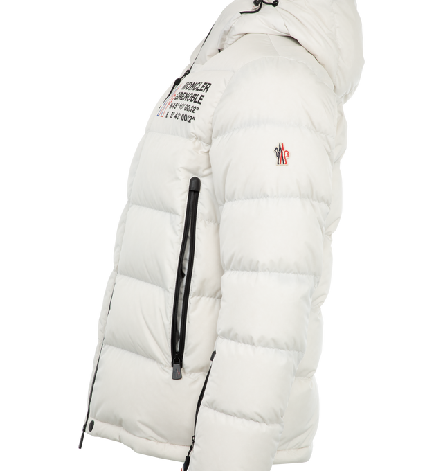 Image 3 of 3 - WHITE - Moncler Grenoble Isorno Jacket has a zip front closure, hood at the back, front zipper pockets, interior snowsuit, thumb holes, and an inner drawcord at the hem to help keep snow and cold out. 100% polyamide. Fill: 9-% goose down, 10% feather. Made in Romania.  