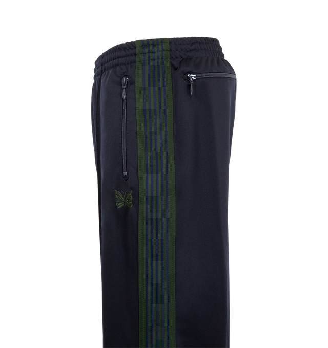Image 3 of 3 - NAVY - Needles Men's Track Pant - Poly Smooth is crafted from smooth polyester jersey and features the brands signature track pant silhouette with side stripe detailing and embroidered branding. Designed for a relaxed fit, this athletic-inspired style combines comfort and versatility with a streamlined profile and elasticized waistband. Main Material: Polyester. Fit: Relaxed. Waist: Elasticized. Details: Side Stripes, Embroidered Logo. Made in Japan. 