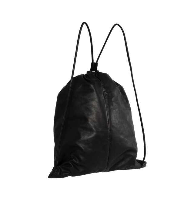 BLACK - THE ROW Puffy Backpack featuring oversized look in smooth nappa leather with center seam detail and drawstring closure. 11 x 18.5 x 3 in. 100% leather. Fully lined in nappa leather. Made in Italy.
