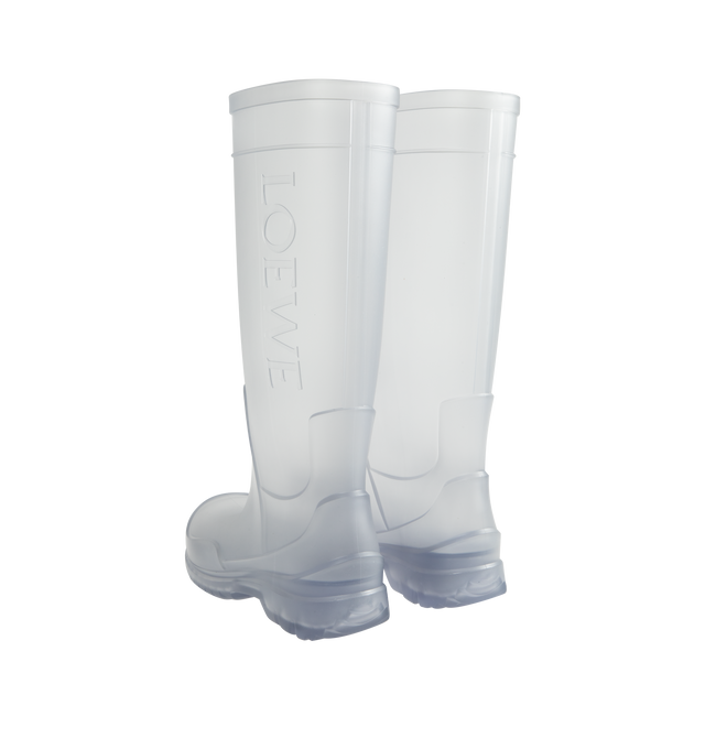 Image 3 of 4 - WHITE - Loewe Women's Storm Boot is crafted from molded transparent PVC and features an oversized Loewe logo at the shaft with a distinctive wavy-pattern rubber outsole. Designed in a sleek pull-on silhouette, the boot combines statement branding with durable all-weather construction. Main Material: PVC. Heel Height: 2 cm (20 mm). Made in Italy. 