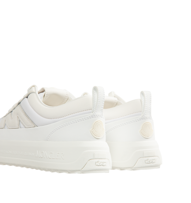 Image 3 of 5 - WHITE - Moncler Mens Altive Sneakers feature a nylon, nubuck, and suede upper. Designed with a lace-up closure, leather lining, OrthoLite insole, foam padding, EVA midsole, TPU spoiler, and Vibram rubber tread. Upper: Cow Leather and 100% Polyamide/Nylon; Lining: Cow Leather and 100% Polyamide/Nylon; Sole: 100% Elastodiene. Sole Height: 4.2 cm. Made in Vietnam. 