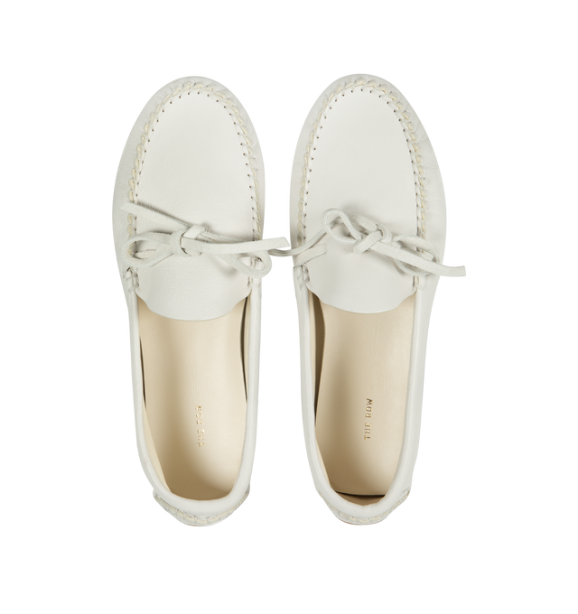 Image 4 of 4 - WHITE - THE ROW Lucca Moccasin featuring grained vegetable-tanned leather with flexible hand-stitched construction and lace-up detail. 100% leather. Made in Italy. 