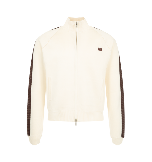 Image 1 of 3 - NEUTRAL - Wales Bonner Men's Tide Track Top is crafted from a viscose-poly knit and features the brand's signature track jacket silhouette in an ivory colorway. Detailed with crochet stripe accents along the sleeves, this refined sportswear style is finished with a double-zip front closure and a stand collar for versatile styling. 80% Viscose, 20% Polyester.  