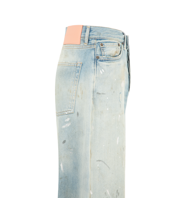 Image 3 of 3 - BLUE - Acne Studios men's 1981  Pale Blue Vintage Jeans are crafted from non-stretch slubby denim and feature a loose-fit silhouette with a low-to-mid rise and wide baggy leg. Finished with a light wash for an authentic worn-in look, these jeans are designed with a long length, classic five-pocket construction, and a button fly closure. Made from organically grown cotton. Main Material: 100% Cotton. Patch: 100% Cow Leather. 