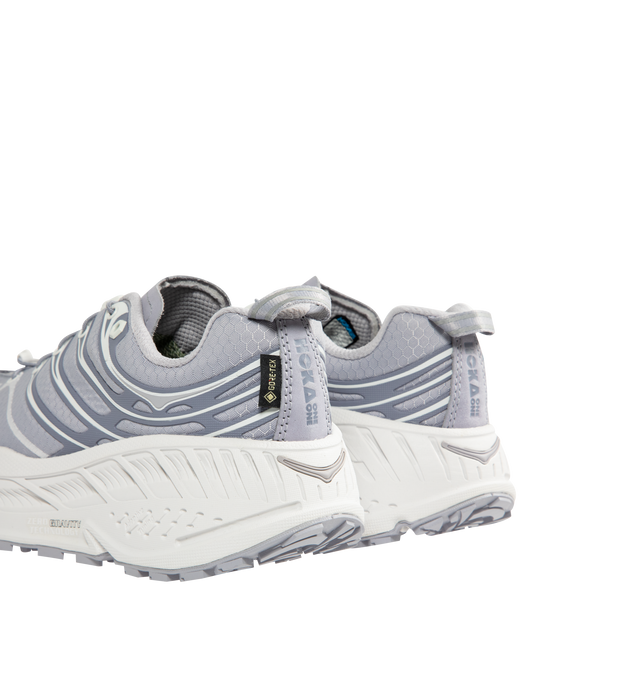 Image 3 of 5 - GREY - HOKA Stinson EVO GTX Sneaker featuring ripstop upper, nubuck toe and heel overlays, waterproof GORE-TEX bootie construction, reflective webbing heel pull, speed-lace system and secondary lace option. 