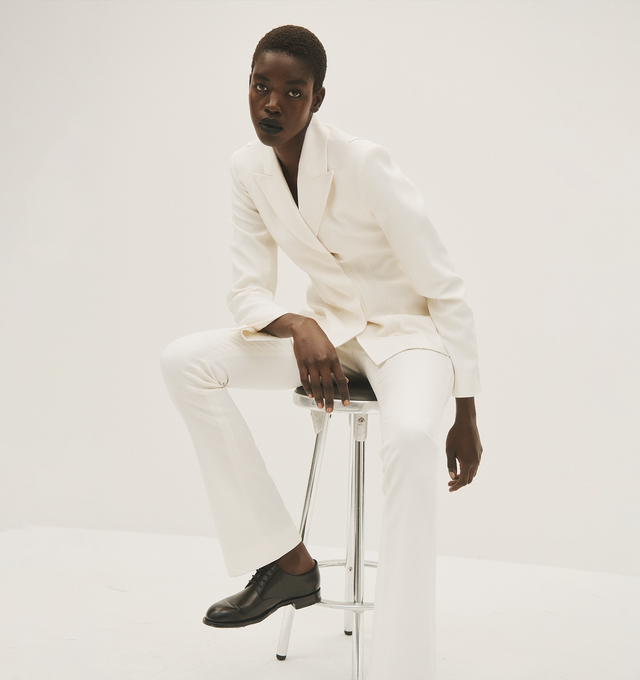 Image 4 of 5 - SILVER - ACNE STUDIOS trousers in white, paneled construction, belt loops, front concealed zip fly closure, inset pockets, back buttoned welt pockets, elongated leg, slim fit. 