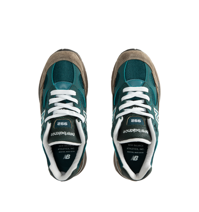 Image 5 of 5 - GREEN - New Balance Made in USA 992 Sneakers feature a timeless silhouette that blends premium craftsmanship with advanced comfort technology. A fan-favorite since its introduction, this seasonal edition showcases a tonal blue upper crafted from breathable mesh and premium suede overlays, contrasted by a black sole unit. ABZORB cushioning at the heel and forefoot provides exceptional impact absorption, while the ENCAP and C-CAP midsole combination delivers lightweight support and stability. F 