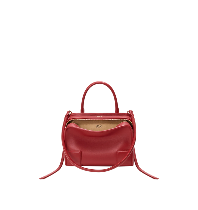 Image 4 of 18 - RED - Loewe Small Amazona 180 Bag in leather features a relaxed silhouette anchored by a single toron top handle, designed to be carried open, while a concealed closure secures the main compartment, three carry options: short handle, removable shoulder strap and crossbody, zip closure with two leather zip pullers, two compartments, main compartment closed with magnetic closure, internal flat pocket, left side d-ring for customization, nappa lambskin lining, and embossed double L branding. Le 