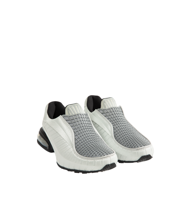 Image 2 of 5 - SILVER - Nike Women's Air Max Dolce features a laceless molded upper with an overlay cage and the signature Air Max silhouette. This streamlined design is detailed with visible Air cushioning in the heel for comfort and a distinctive profile. Designed as a versatile slip-on style. Upper: 70% Calf Leather, 15% Patent Calf Leather, 15% Fabric. Lining: 100% Fabric. Sole: 100% Rubber. 