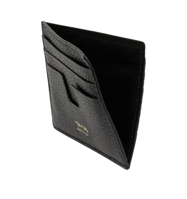 Image 3 of 3 - BLACK - TOM FORD Grain Leather T Line Card Holder featuring premium grained calf leather with gold-tone foiled logo lettering on the front, signature T-shaped card slots, one center compartment, six card slots and embossed logo on the front. Approx. 3"H x 4"W. Made in Italy. 