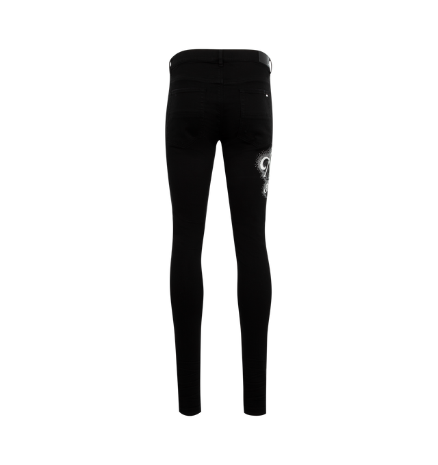 Image 2 of 3 - BLACK - AMIRI Crystal Logo Jeans featuring logo lettering with crystal embellishment at right thigh, regular rise, five-pocket style, full length, fitted through skinny legs and button zip closure. 100% cotton. 