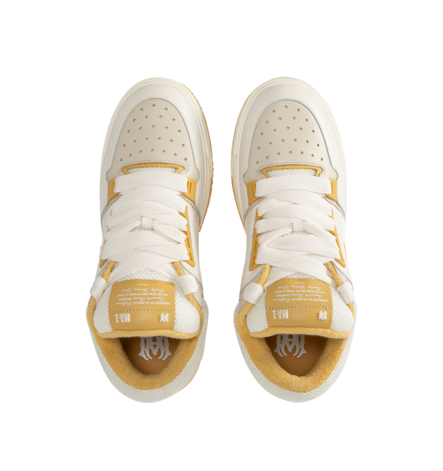 Image 5 of 5 - CHAMPAGNE - Amiri MA-1 Sneakers are a lace-up style with two-tone uppers, a double lace fastening, MA icon hardware, a logo at the back, and exaggerated rubber outsoles. 100% leather uppers. Made in Vietnam.  