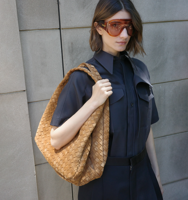 Image 2 of 4 - BROWN - BOTTEGA VENETA Large Campana Bag featuring shoulder bag with archival silhouette in soft Intrecciato suede, internal zipped pocket and leather tie closure with hidden magnet. 9.4" x 15.4" x 7.3". Calfskin. Made in Italy. This item may be restricted for online purchase to international clients. For assistance purchasing this item please contact our dedicated stylist team at personalshopping@hirshleifers.com. 